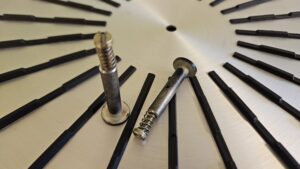 Bushings, spring and screws for back pieces